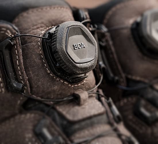 Close-up of a brown leather boot with BOA system buckle