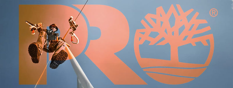 A worker over a the Timberland logo background.